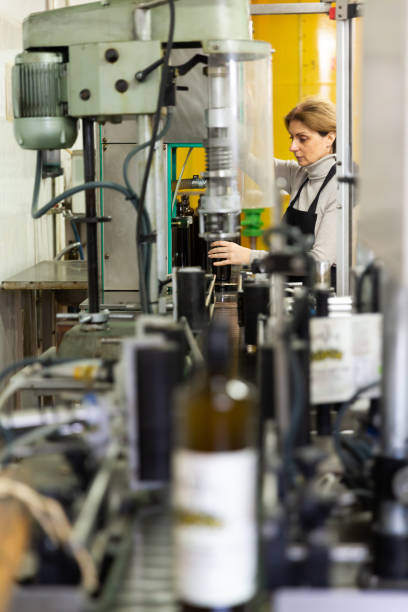 istock Woman working on olive oil bottling conveyor 1277569717