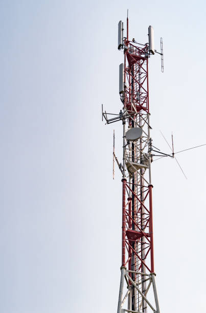 istock Red and white telecommunications tower with various transmission equipment 1277574157