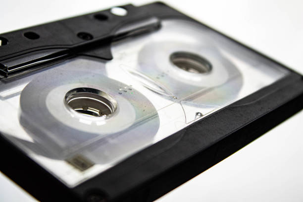 istock Disassembled audio cassette. Tangled cassette tape in knots. 1277575654