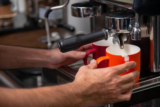 istock Espreesso coffee pouring from coffee machine 1277578287