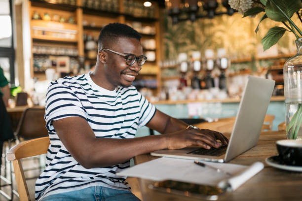 istock Happy African American man working on his laptop 1277578334