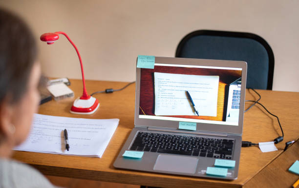 istock Senior woman tutoring online from home using a laptop and webcam 1277578648
