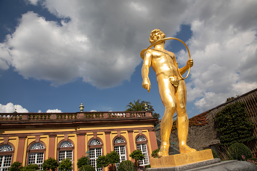 Weilburg, Germany - September 7, 2020: Golden Sculpture in the Orangery of Residence Weilburg, Hessen, Germany