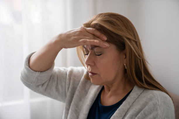 istock Woman at home having a terrible headache 1277582543