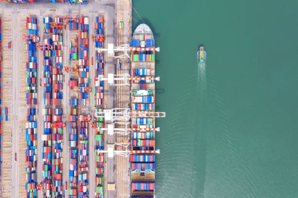 istock Container , container ship in export and import business and logistics. Shipping cargo to harbor by crane. Water transport International. Aerial view and top view. 1277583522