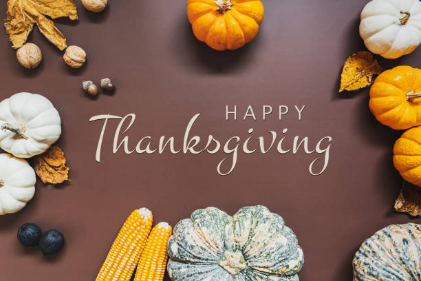 istock Happy Thanksgiving Day with pumpkin and nut on the table 1277584874