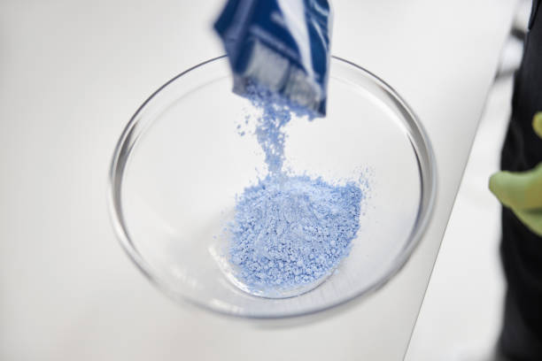 istock Transparent bowl being filled with blue powder 1277587929