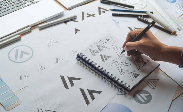 istock Graphic designer creative design sketch drawing logo Trademark brand Workspace 1277590253