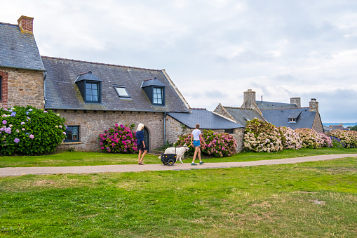 Ile de Brehat, France - August 27, 2019: Country House with Flower Garden at picturesque Ile de Brehat island in Cotes-d'Armor department of Brittany