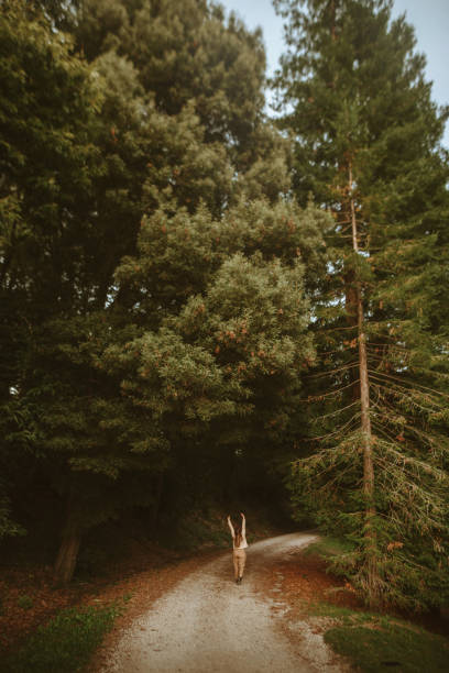 istock Woman walking in a forest in autumn 1277592514