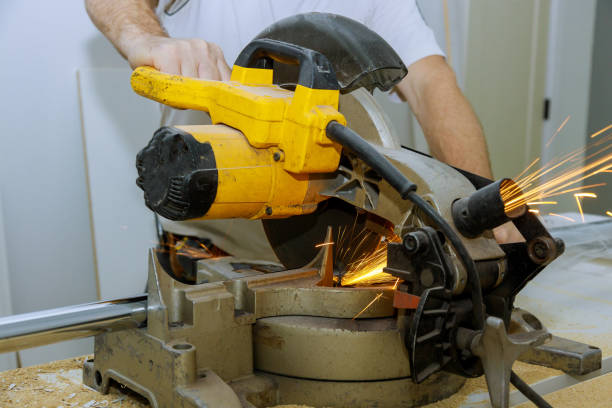 Closeup of metal cutting saw a steel pipe worker sawing metal a saw, sparks fly Closeup of a metal cutting saw a steel pipe worker sawing metal a saw, sparks fly miter saw stock pictures, royalty-free photos & images