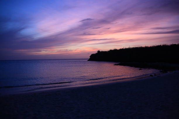 istock Dramatic Sky at Sunset on the beach in Curacao 1277595198