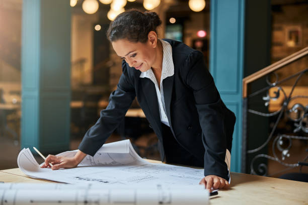 istock Cheerful brunette woman staring at her sketch 1277595387
