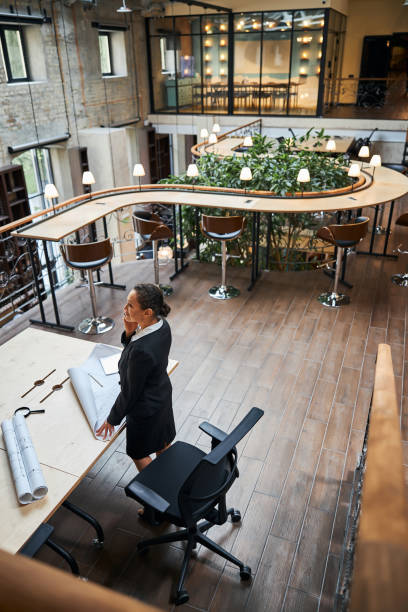 istock Busy office manager standing at her workplace 1277595406