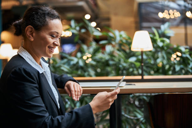 istock Joyful young female person reading income message 1277595413