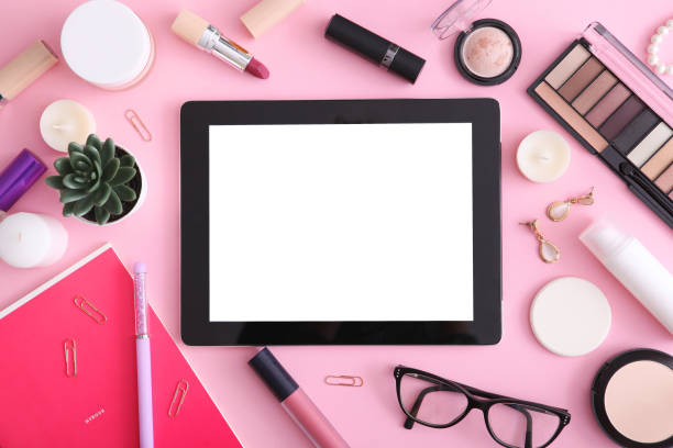 istock cosmetics and modern tablet on a colored background top view. Beauty blog concept. 1277595803