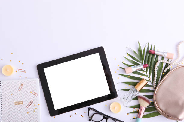 istock cosmetics and modern tablet on a colored background top view. Beauty blog concept. 1277596174