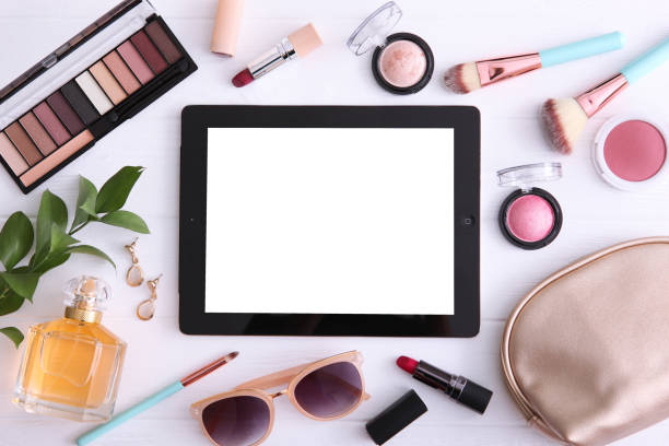 istock cosmetics and modern tablet on a colored background top view. Beauty blog concept. 1277596262