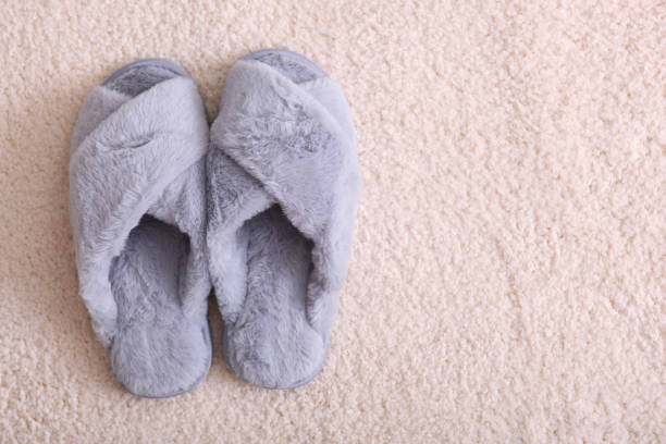 istock cozy composition with home slippers top view. 1277597406