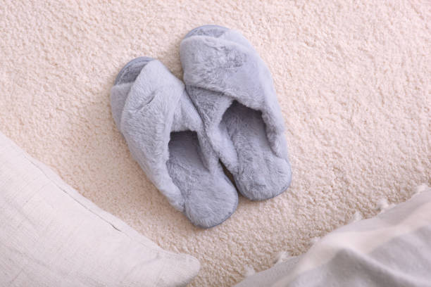 istock cozy composition with home slippers top view. 1277597519