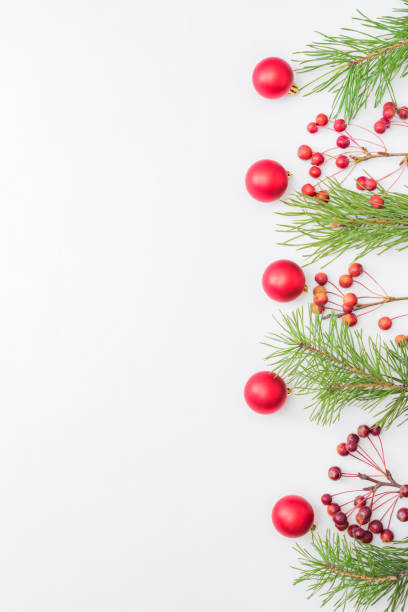istock Flat lay border with red christmas decoration, pine branches on a white background 1277599962