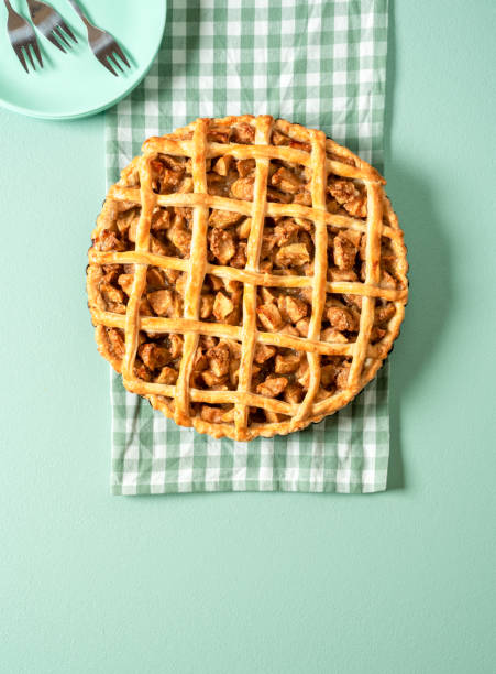 istock Homemade apple pie top view on green table. Delicious apple cake. 1277601677
