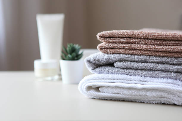 istock a stack of fresh towels on the table. 1277601703