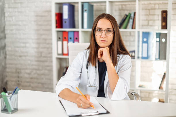 istock Female doctor with a clipboard indoors 1277605701