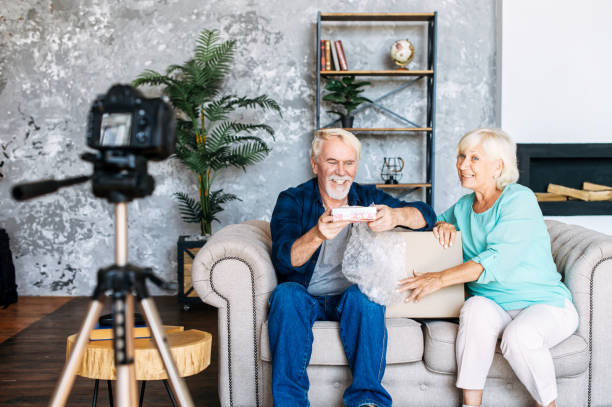 istock Senior couple is recording video blogs 1277605826