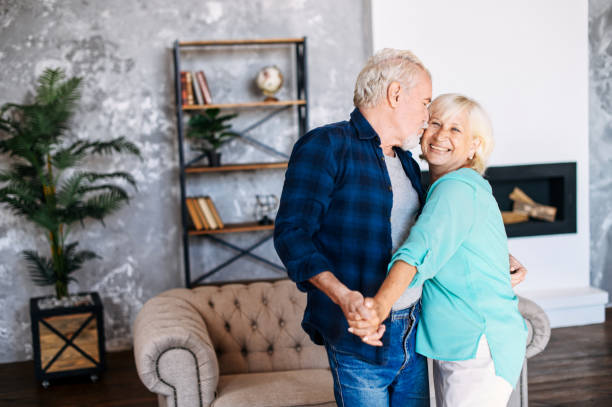 istock Romantic modern senior couple hagging indoors 1277605839