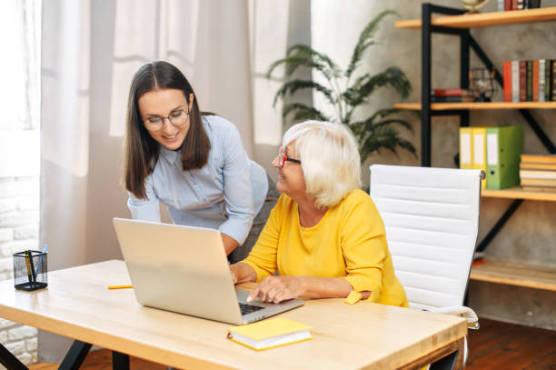 istock Two female colleagues in the office using a laptop 1277605844