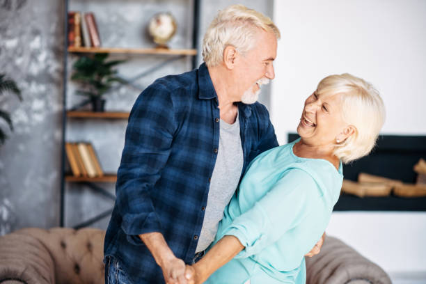 istock Romantic modern senior couple hagging indoors 1277605867