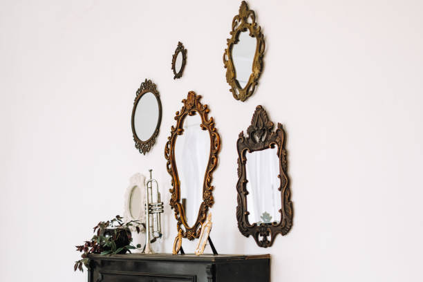 istock Antique old mirrors on a white wall indoor. Interior design. 1277606834