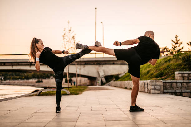istock Man and a woman practice kick boxing 1277607485