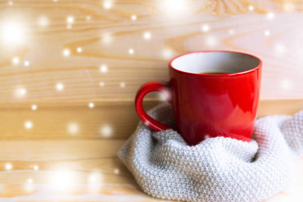 istock Red coffee cup and sweater on wooden background, winter background 1277607631