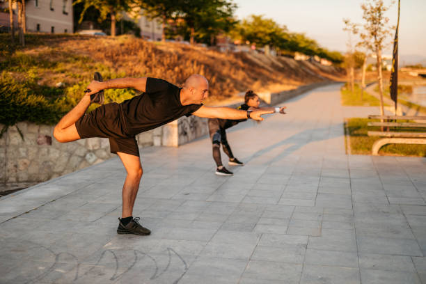 istock Man and a woman working out by the river 1277608738