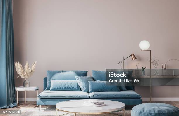 Stylish Modern Interior Of Living Room With Trending Home Accessories Marble Coffee Table Dried Flowers And Blue Sofa Stock Photo - Download Image Now
