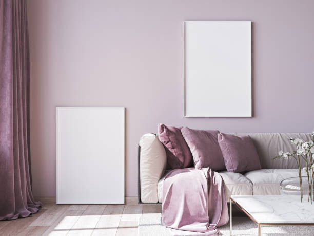 istock Frame mock up with modern sofa on light pink wall background and trendy home accessories, home decor interior. Stock photo 1277610556