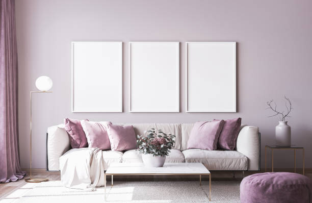 istock Frame mock up with modern sofa on light pink wall background and trendy home accessories, home decor interior. Stock photo 1277610737