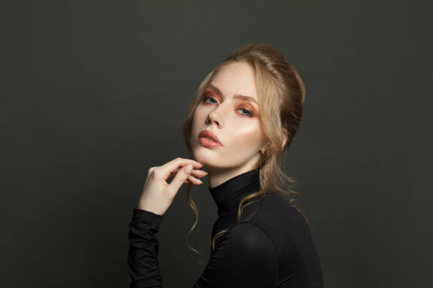 istock Stylish fashion model on black background, portrait 1277611949