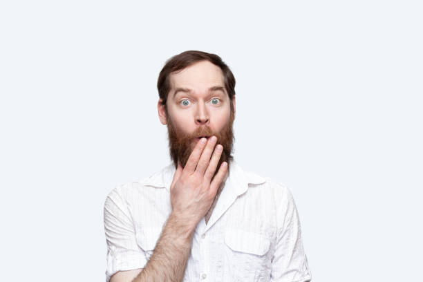 istock Surprised man covering mouth with hand 1277612090