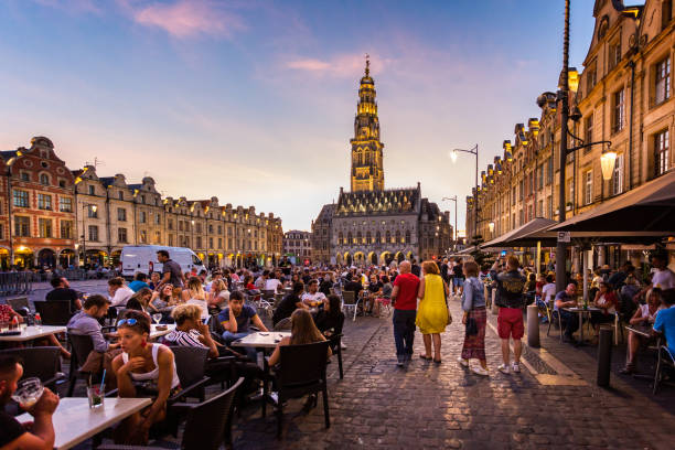 Busy outdoor street cafes at sunset on the cobblestones of Arras, Pas de calais, France stock photo