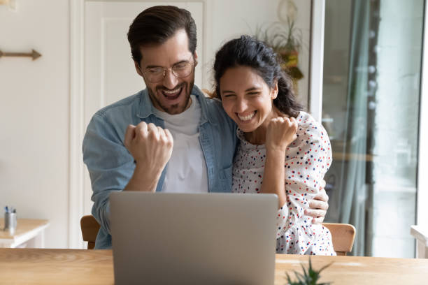 istock Overjoyed millennial couple excited with lottery win 1277613369