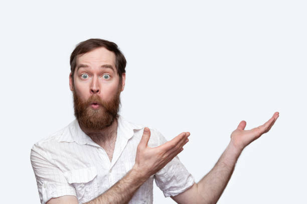 istock Surprised man pointing hands to the side 1277613490