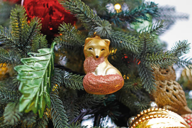 Christmas toy fox hanging on Christmas tree