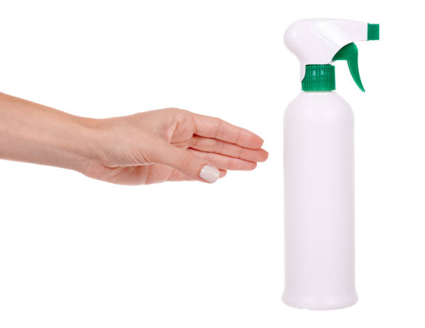 istock Hand with disinfectant spray in the bottle. Isolated on white background. 1277617574