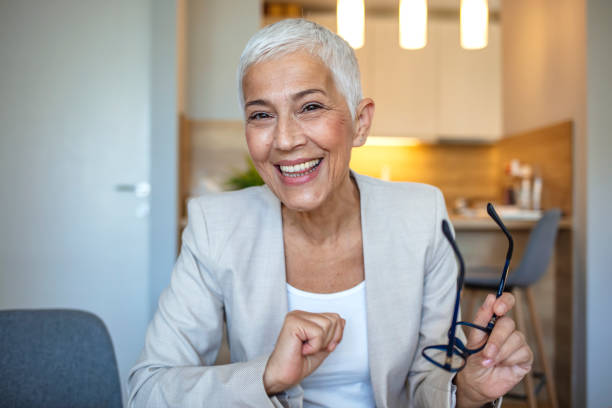 istock Happy old online teacher tutor look at camera give educational training class lecture teach by webcam 1277618213