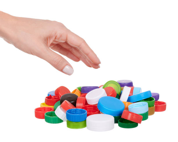 istock Hand with plastic lids, isolated on white background. 1277619408