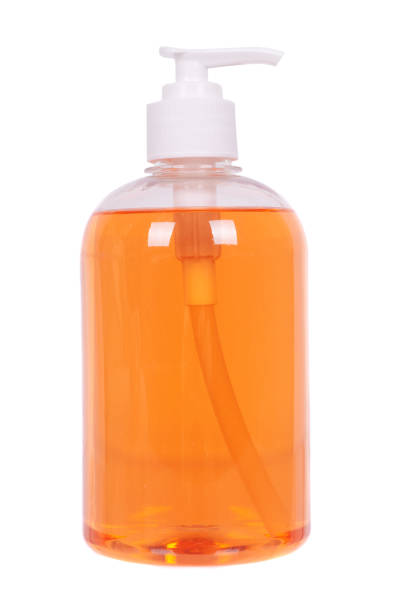 istock Orange liquid soap in a bottle, isolated on white background. 1277619662