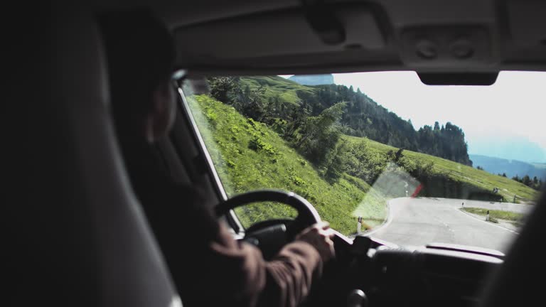 Man driving motor home on mountain during weekend